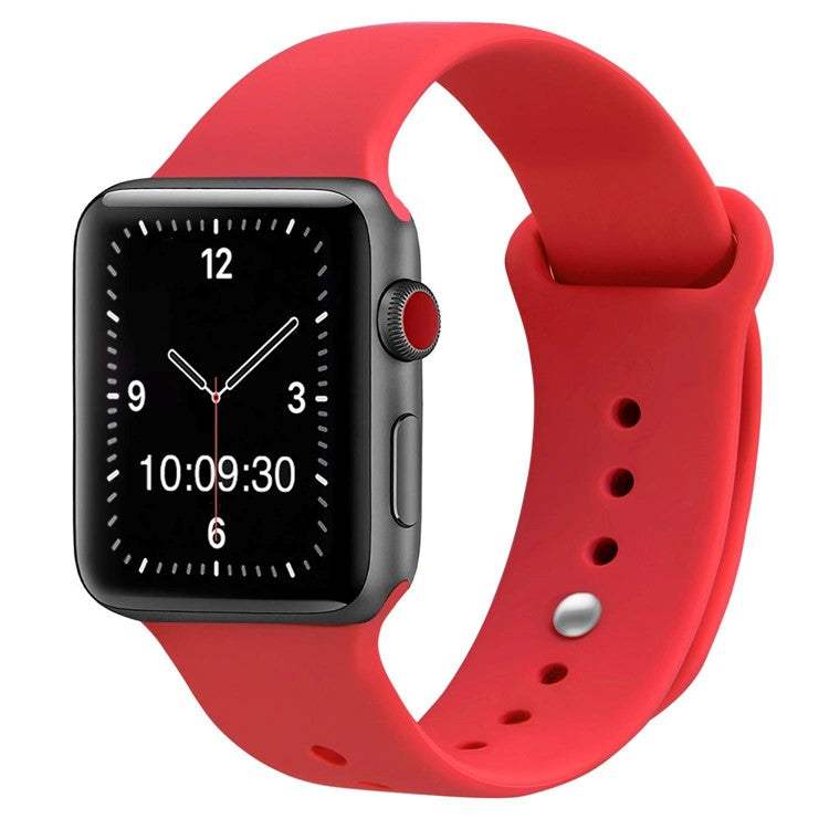 Red silicone sport Apple Watch strap, compatible with all sizes and generations, featuring a secure pin and tuck closure.