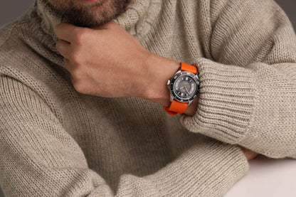 Kennett Solaxplorer Solar Watch with orange strap, 100m water-resistant, eco-friendly solar power.